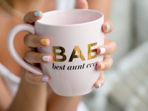 person-holds-out-a-mug-that-says-best-aunt-ever_2048x