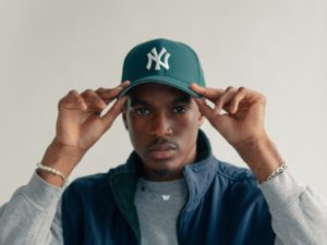 young-man-adjusts-his-baseball-cap_2048x